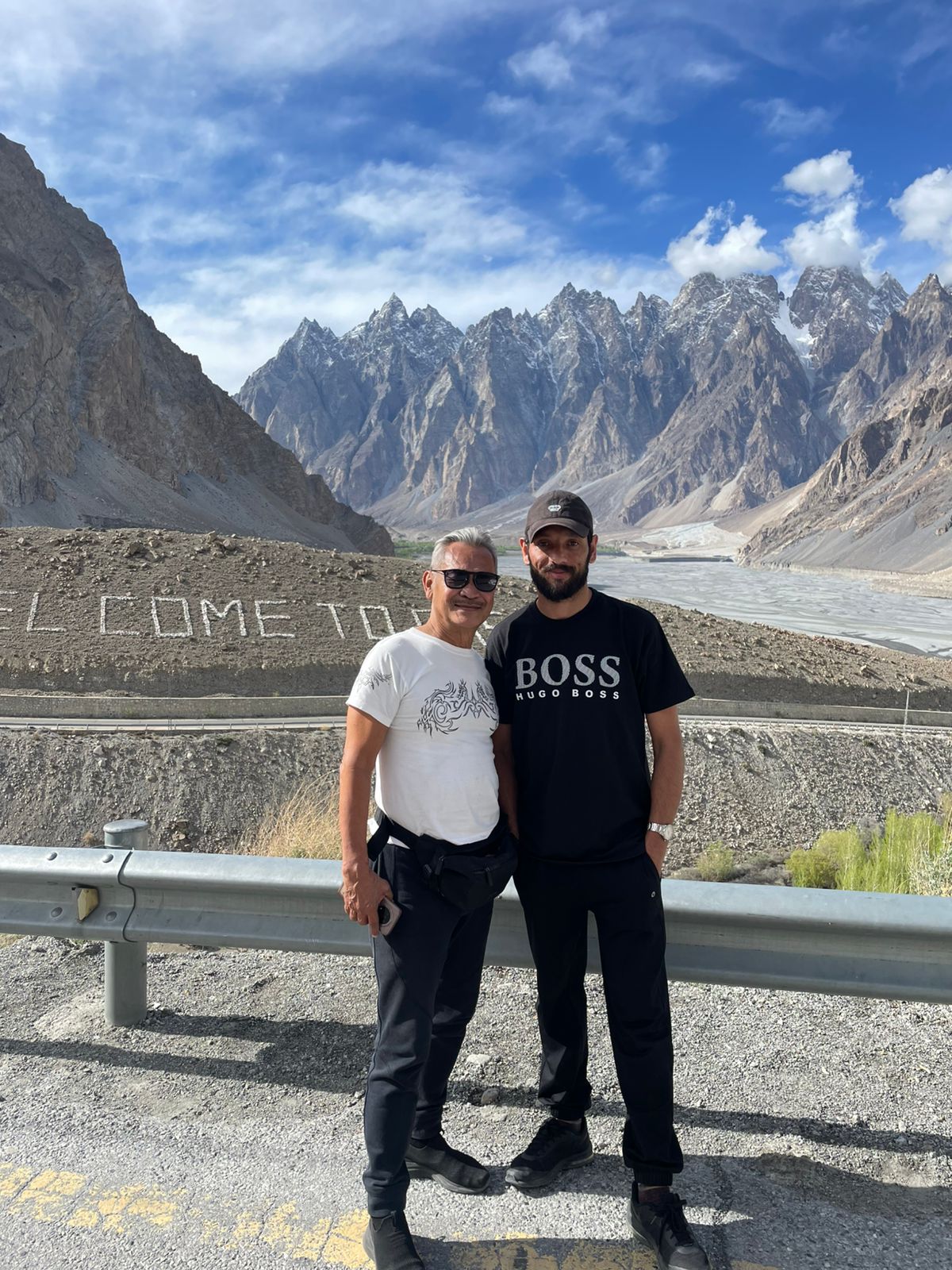 Founder Zahir Ali Shah with a client at the Passu Cones viewpoint, Hunza